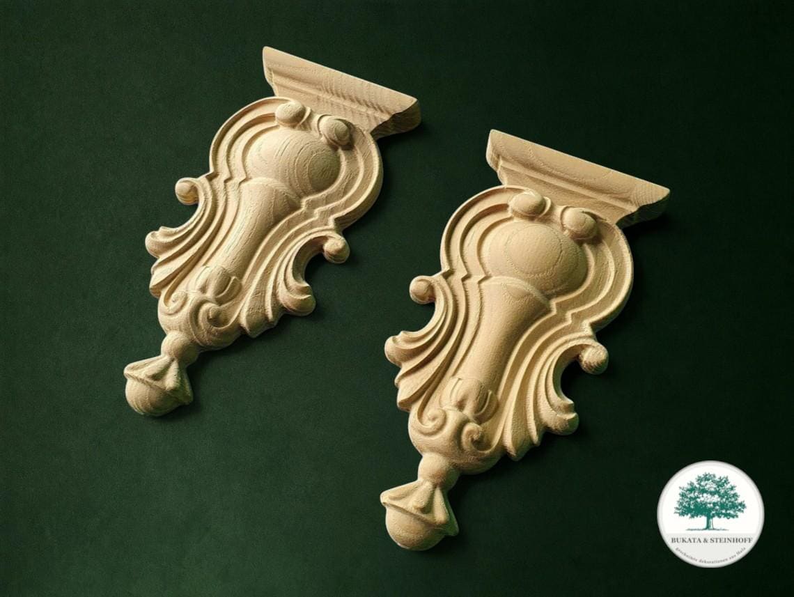 two ornate wooden carvings with intricate designs, placed against a dark green background.