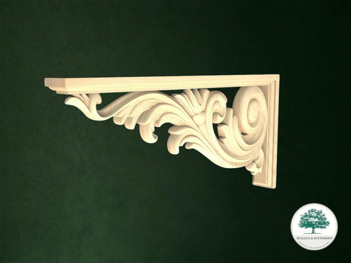 A decorative wooden bracket with an ornate scrollwork design, mounted on a dark green background.