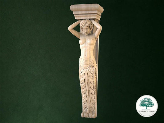 A carved wooden statue of a woman with her arms raised, standing on a pedestal.