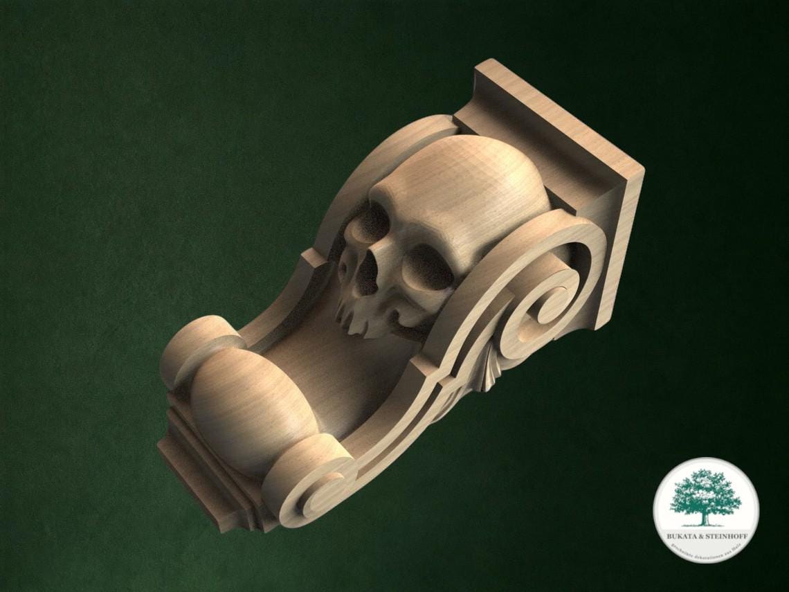A wooden carving of a skull with a ball at the bottom, set against a dark green background.