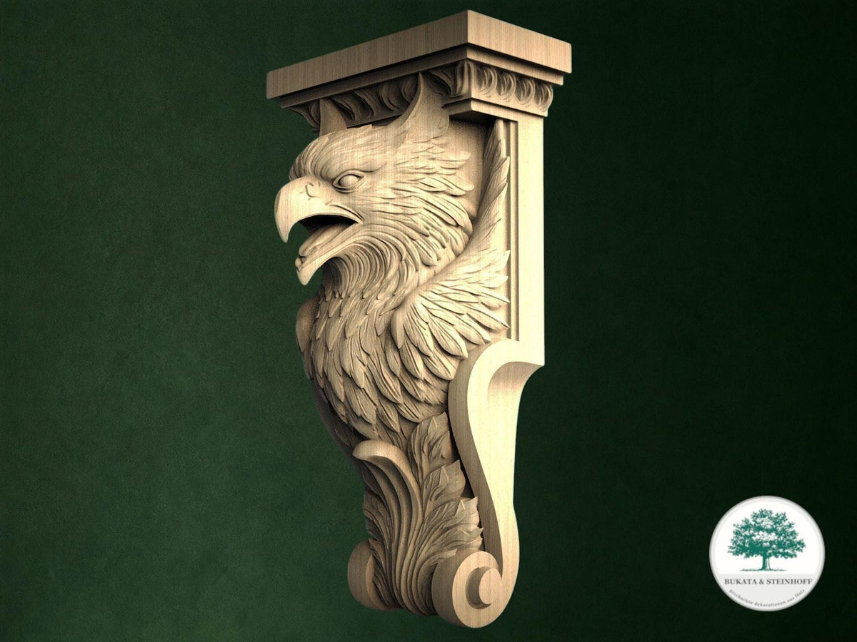 A carved wooden eagle or phoenix-like figure with a carved head and wings, mounted on a wooden bracket or post against a green background.