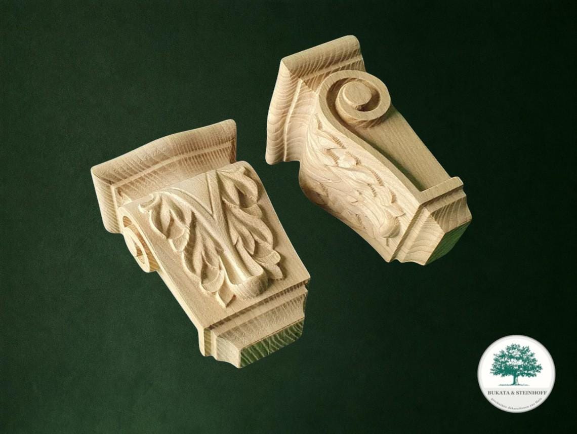 two intricately carved wooden pieces, likely made of wood, set against a dark green background.