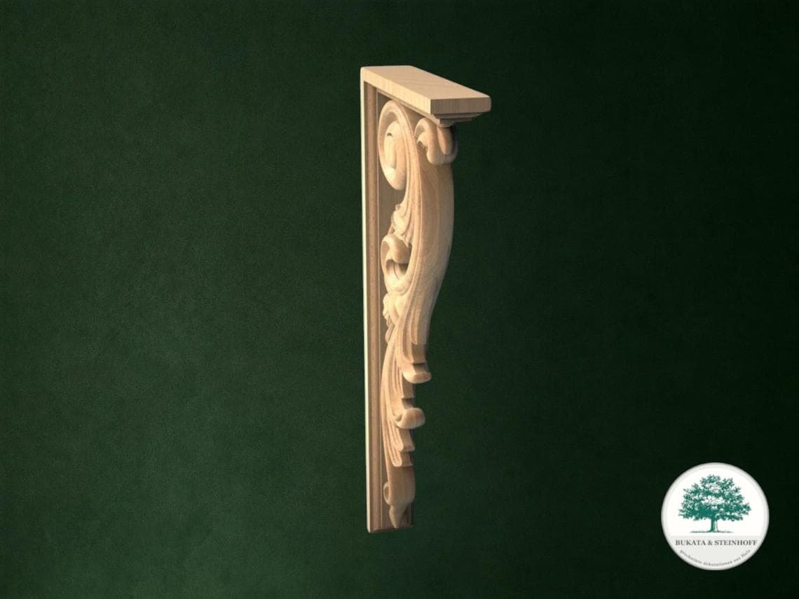 a decorative wooden bracket with an ornate, carved design on a dark green background.