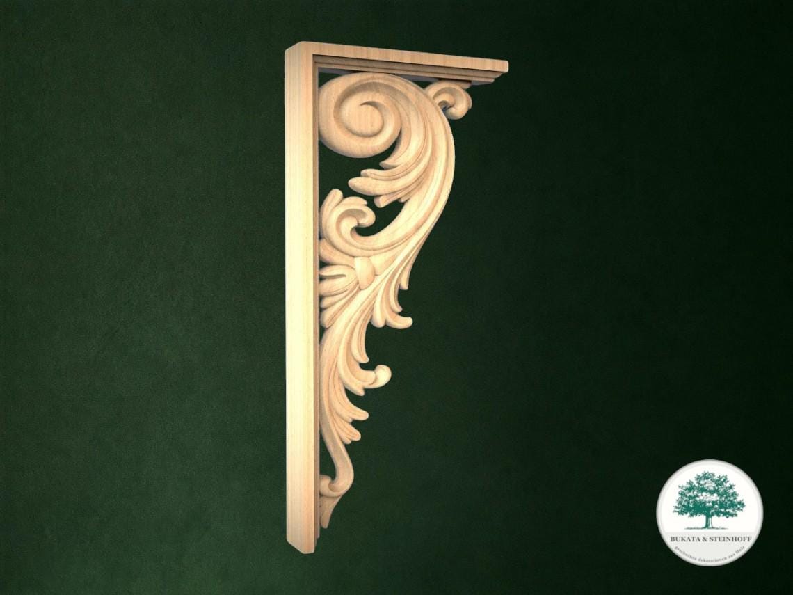 a decorative wooden bracket with an ornate scroll design, set against a dark green background.