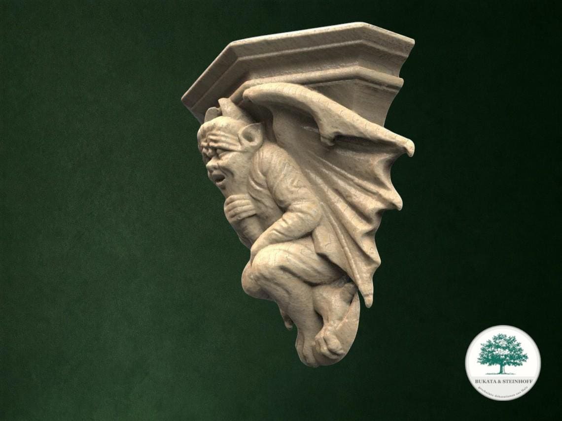 A stone carving of a gargoyle figure is displayed against a dark green background.