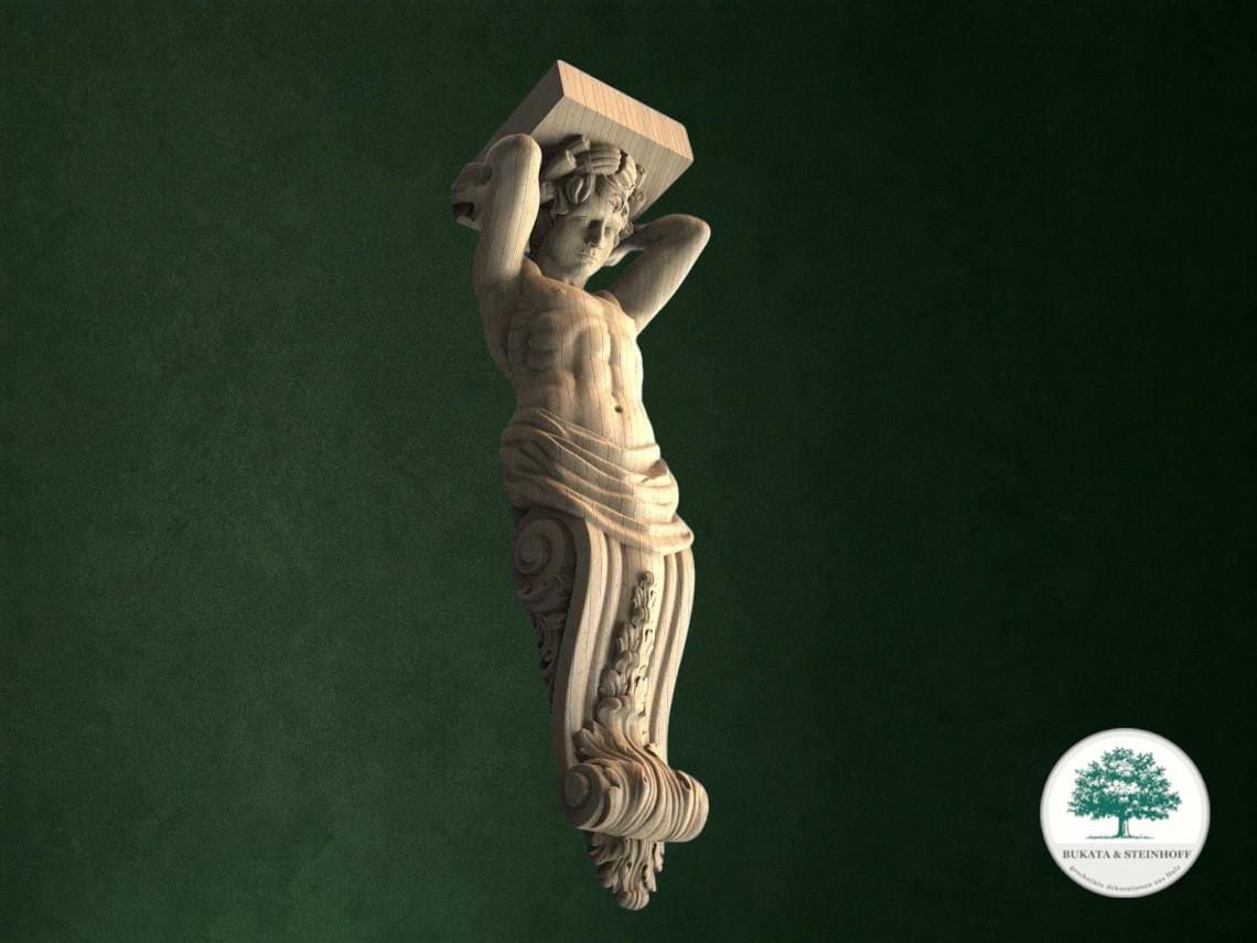 A carved wooden sculpture of a human figure holding a rectangular object, set against a dark green background.